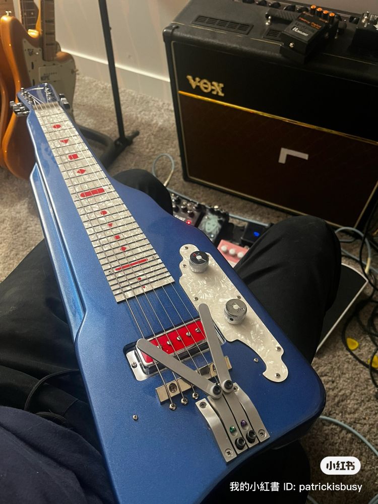 A lap steel guitar with palm benders