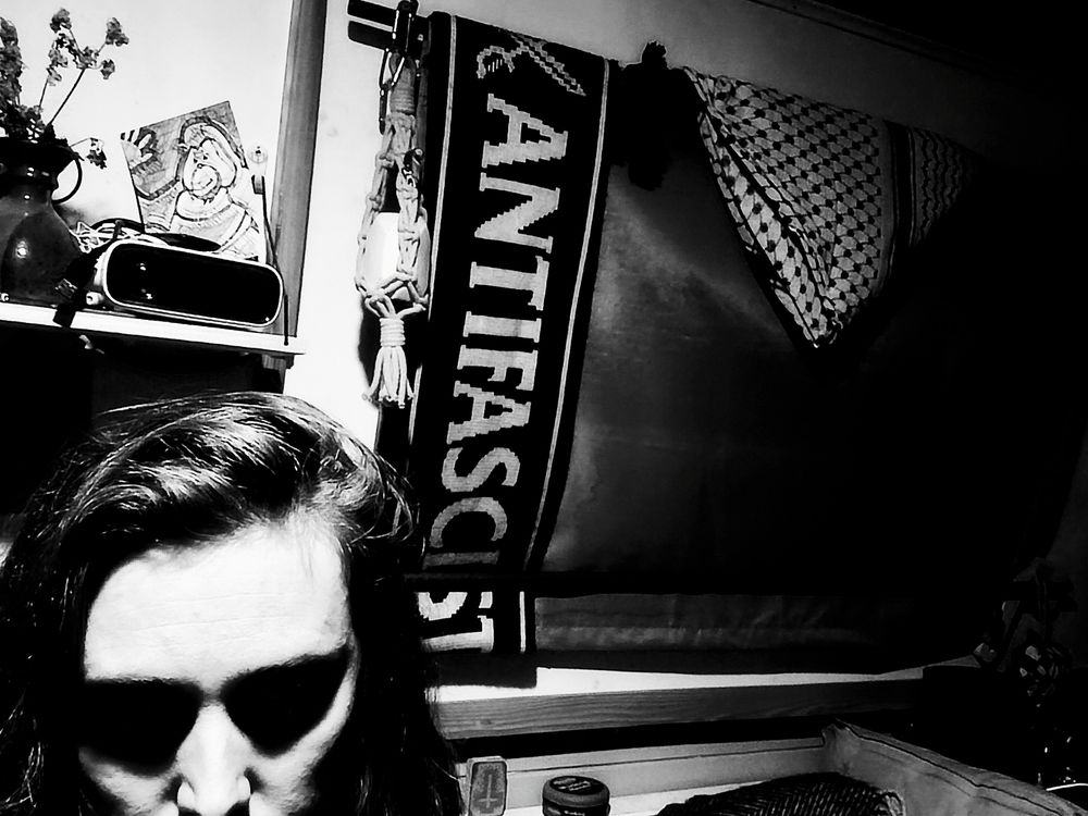 Silly black and white filtered selfie with my "ANTIFASCIST" scarf and keffiyeh 