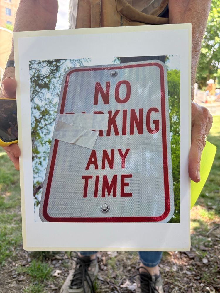 A NO PARKING ANY TIME sign but someone put tape over the PAR so it says NO KING AT ANY TIME