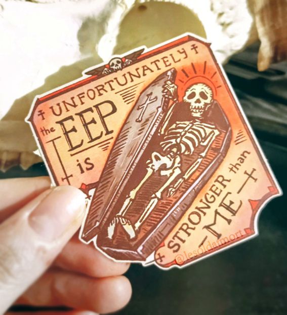 Photo of a sticker with a skeleton in a coffin with a text around: Unfortunately, the EEP is stronger than me."