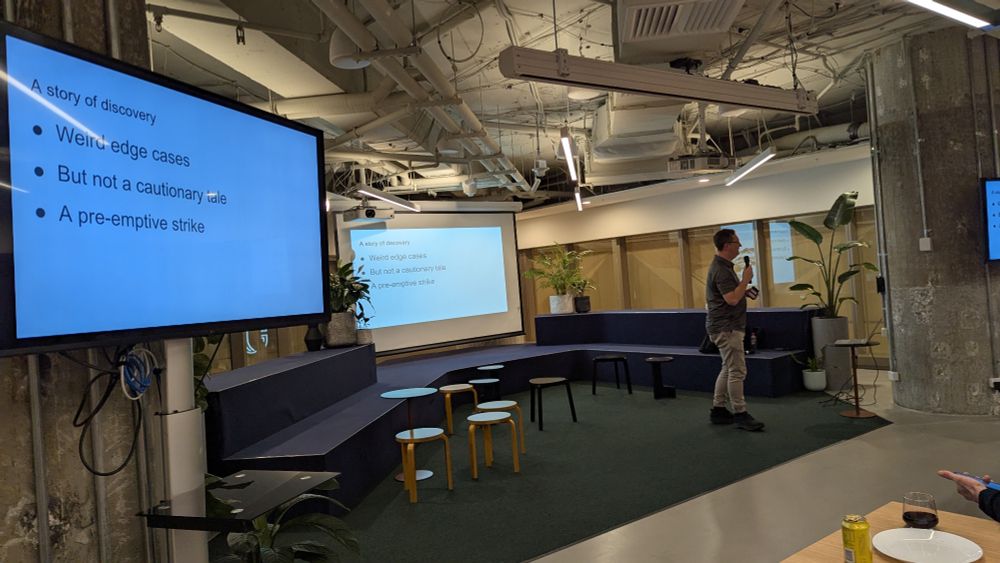 A photo of Jason in front of his title slide