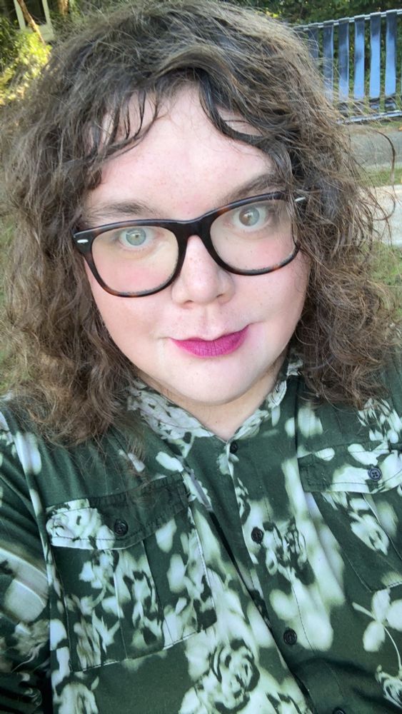 Robin Val smiling at the camera