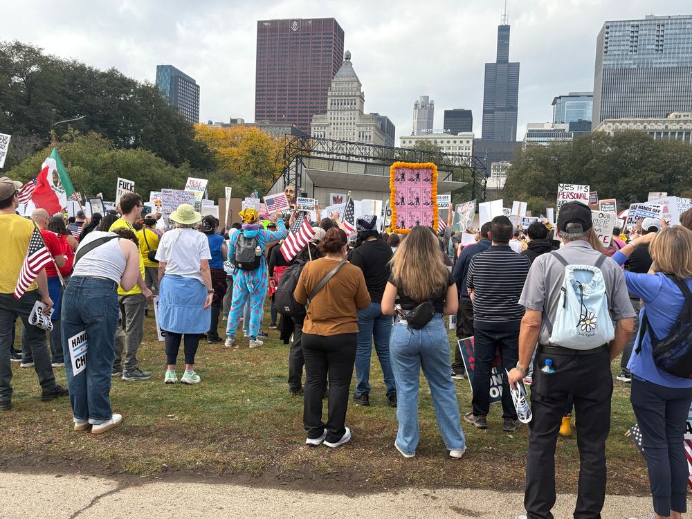 Individuals gathered in Chicago’s Grant Park for the No Kings Rally and March, Saturday, 18 October 2025. Chicago skyline, including the Willis Tower (formerly the Sears Tower) in the right center background 