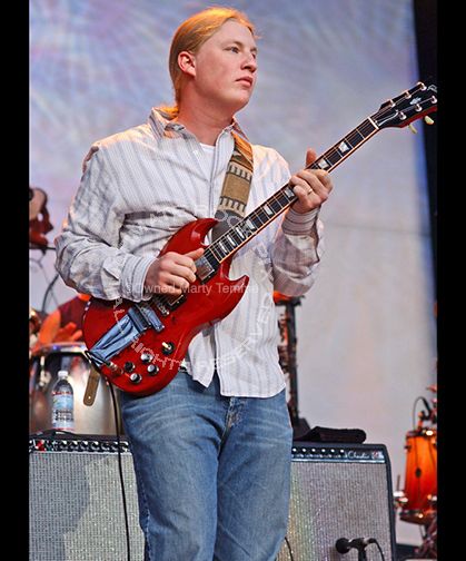 Photo of guitar player Derek Trucks playing his Gibson SG in concert in 2005 by Marty Temme.