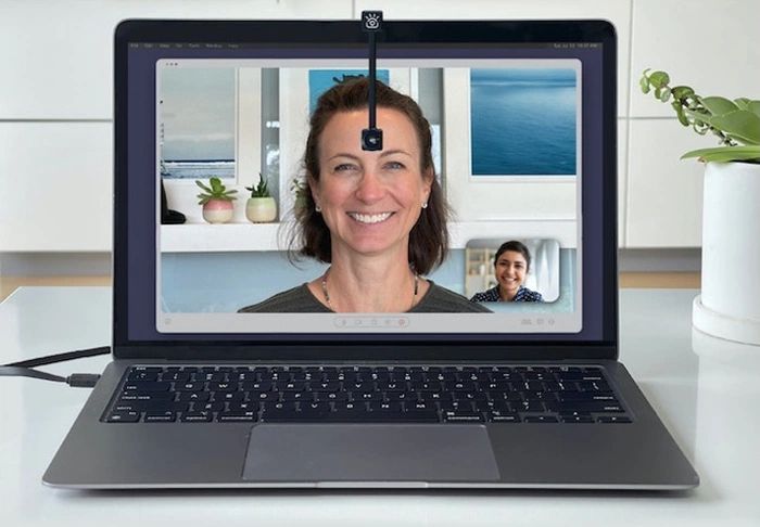An image of the iContact webcam in use, it's a webcam with a flexible neck that you can position in the middle of the screen so that your eyeline matches the people you are talking to.