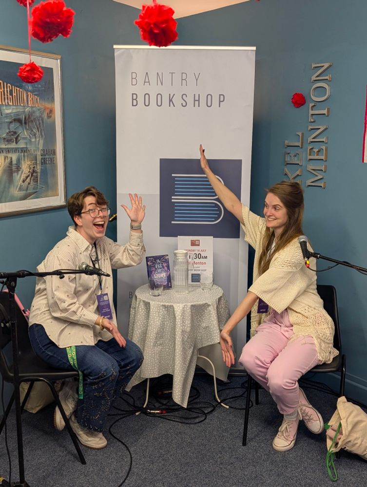 Molly and Kel pose beside their debut book "A Fix of Light".