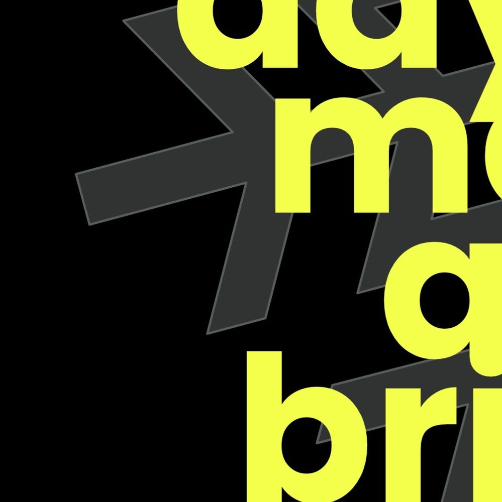 Cropped abstract image of neon yellow typography against a black background.