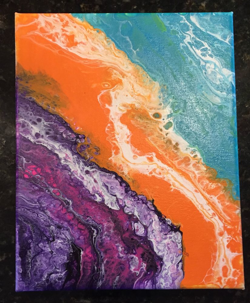 A pour painting with Blue, Orange, and Purple patches. White spreads through each patch. Pink peeks through some of the purple patch, and green peeks through some of the blue. 