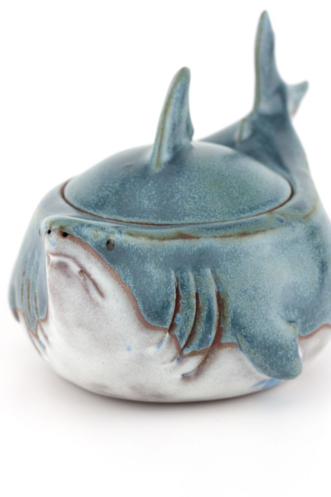 Ceramic round shark jar close-up three quarter turned facing the forward