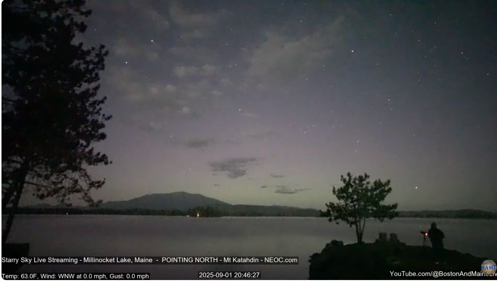 screencap from the Mount Katahdin livestream on Youtube showing a lake with a mountain in the distance 