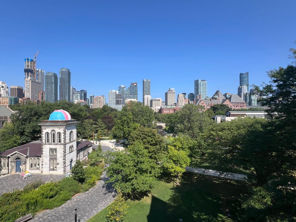 Lush u of T campus w city skyline & queens park in background 