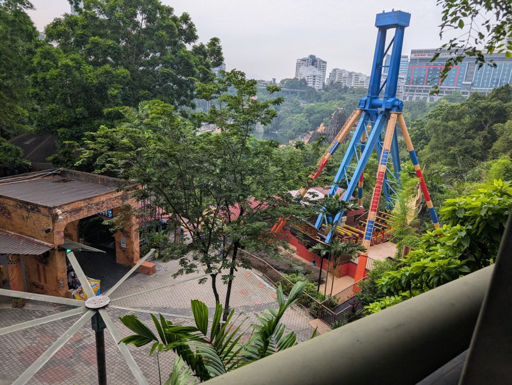 An amusement park below the walkway 