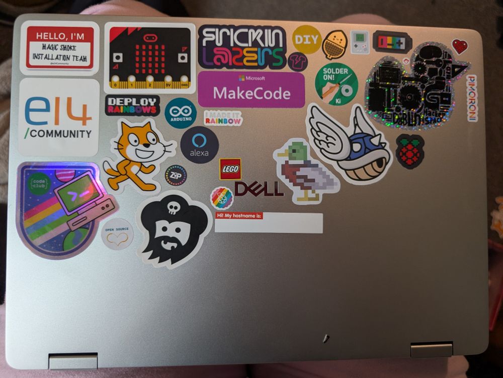 A laptop full of cool stickers
