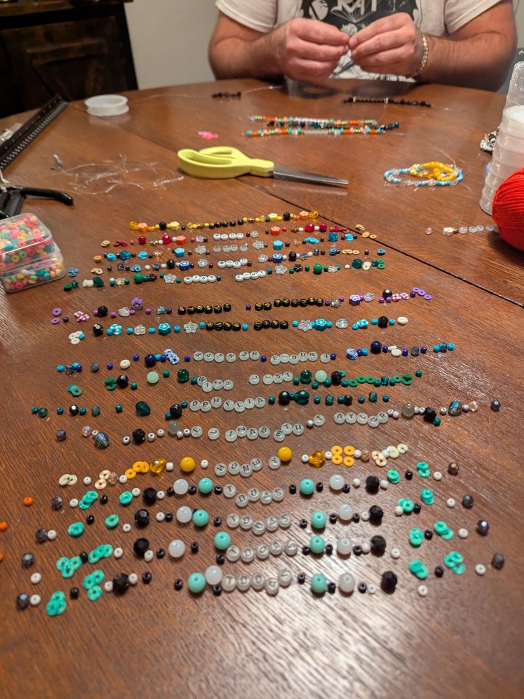 beads laid out in patterns before being strung into bracelets 