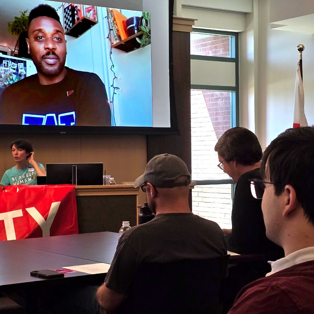 This is a photo of SnoCo DSA members listening to Rep Shaun Scott as he joins our July General Meeting via Zoom.