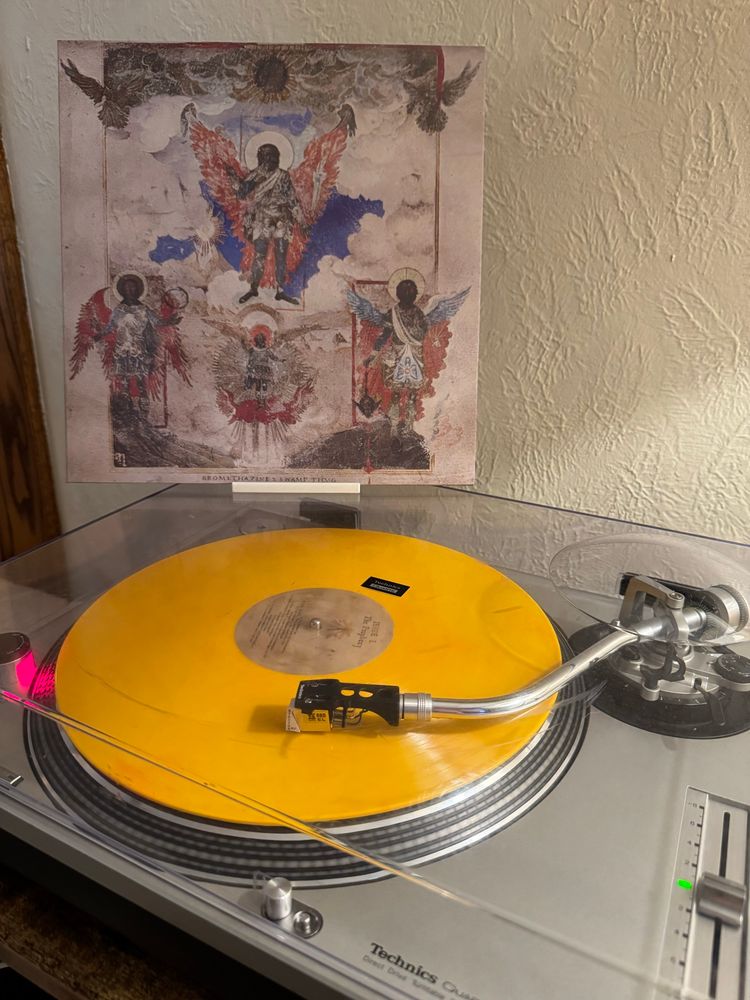 The first side of The Triptych by Bromethazine x Swamp Thug in yellow vinyl playing on a Technics SL-1200MK2.
