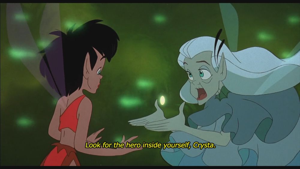 Screenshot from the 1992 animated film Ferngully: The Last Rainforest. On the left is a fairy with short black hair wearing red clothes. She looks to the right at an aged fairy with silver hair in blue who says to her: "Look for ther hero inside yourself, Crysta."