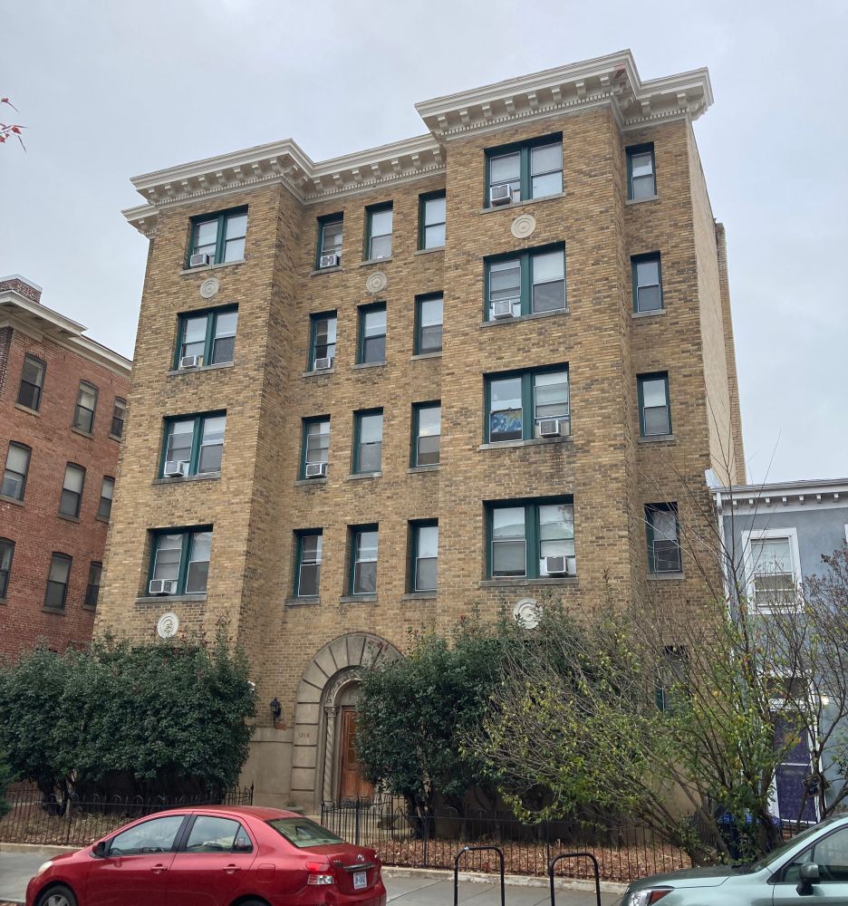 5 story apartment building with cornice 