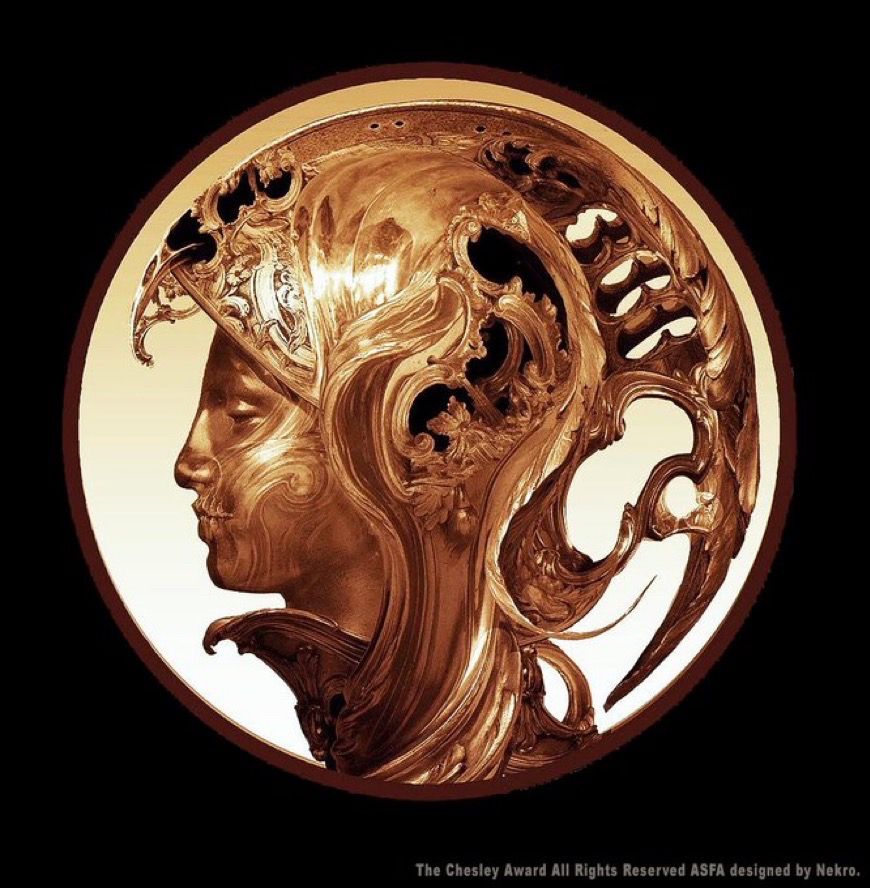 Medallion of Athena in bronze with a large helmet that curves around the back of her head.