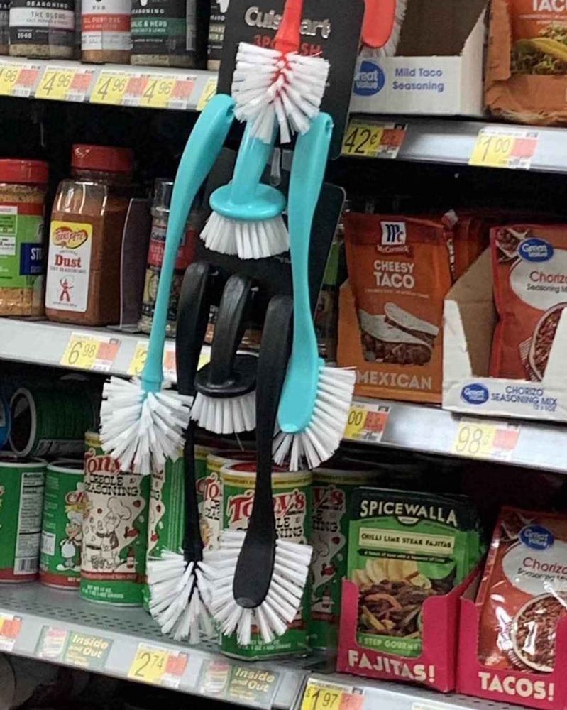 a rack of toilet brushes that look alarmingly like Hatsune Miku