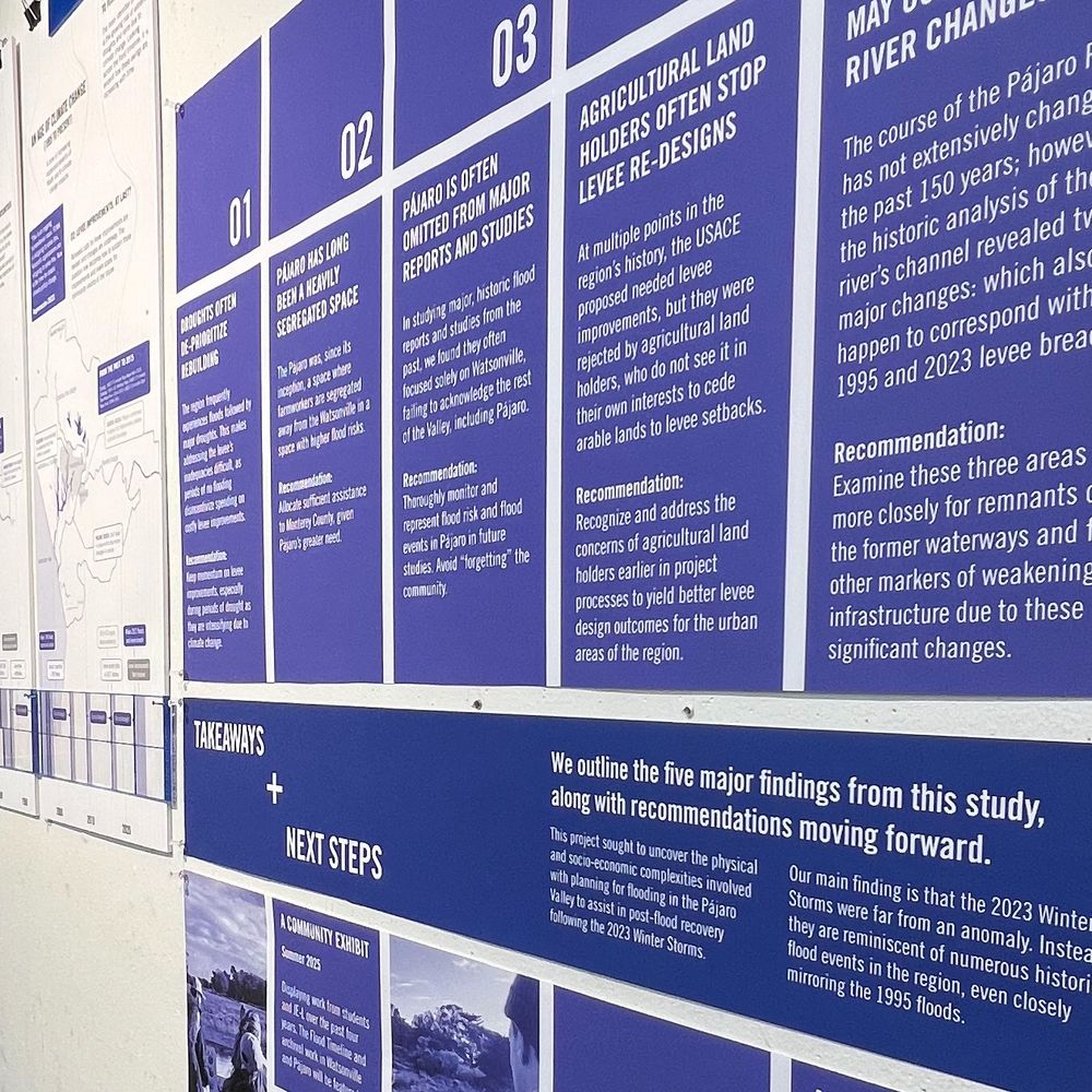 Photograph of exhibit boards on a wall.