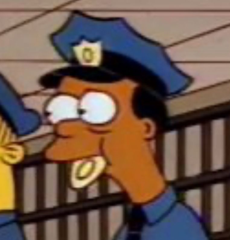 The Simpsons police officer with a badge in his mouth 