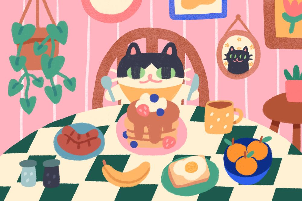 art of a little tuxedo cat with a spoon and knife in hand, ready to eat a large spread of breakfast items. 