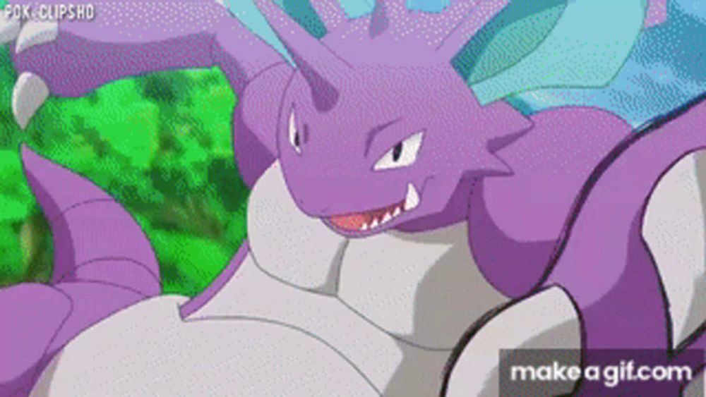 a purple and white pokemon with the words make a gif.com at the bottom of the screen