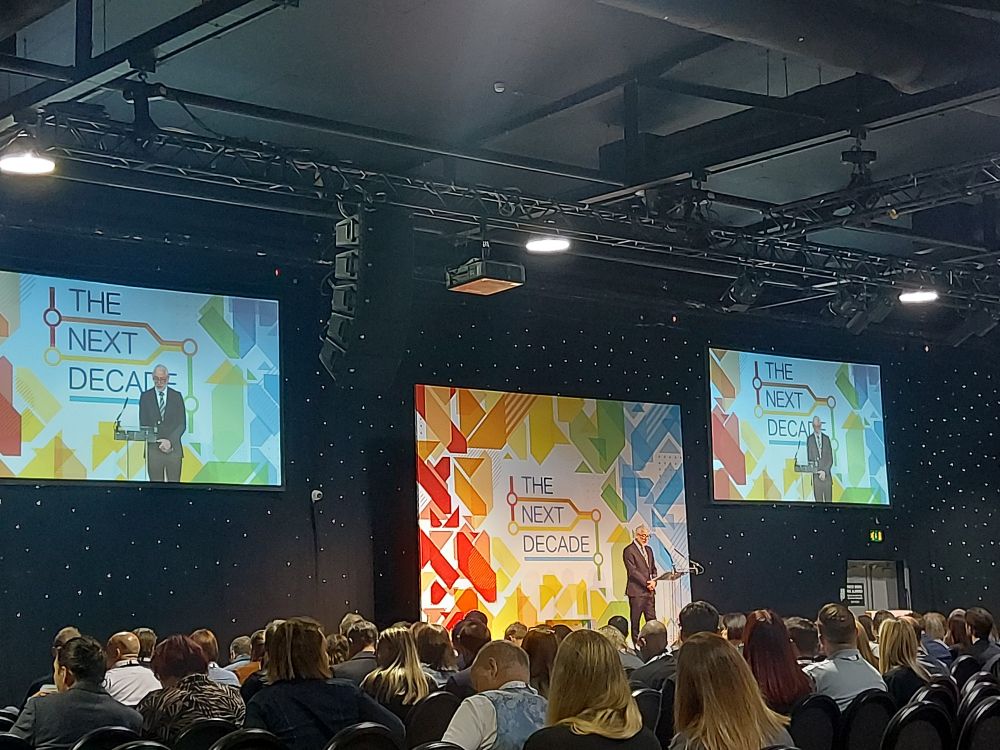 Photo of Mark Wilson, CEO of Wellspring Trust, opening The Next Decade Conference at the Royal Armouries in Leeds.