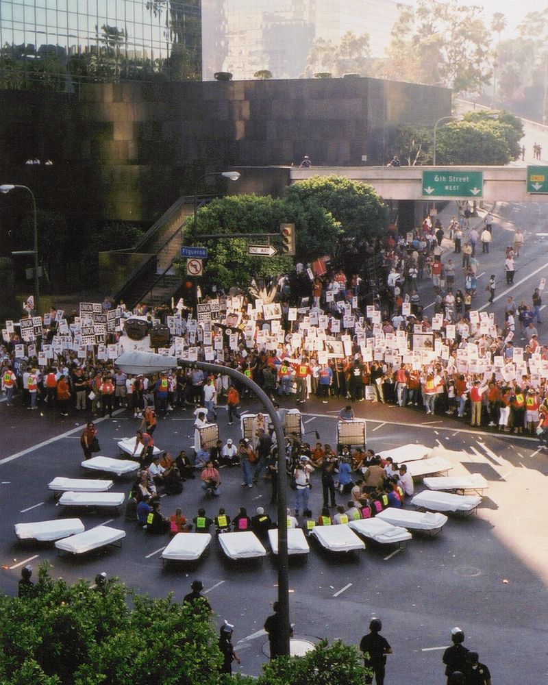 Housekeepers demonstration downtown and civil disobedience, 2004. Los Angeles Alliance for a New Economy (LAANE) collection, UCLA Library Special Collections.
