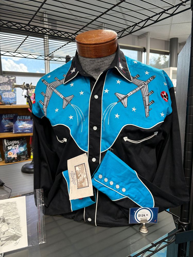A western-style shirt. The bottom is black and it's blue over the shoulders. There are embroidered B-52 planes and starts over each shoulder