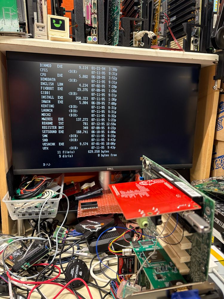 Photo from further back showing a PicoGUS with a USB stick inserted and a directory listing of the Mechwarrior 2 CD on the screen