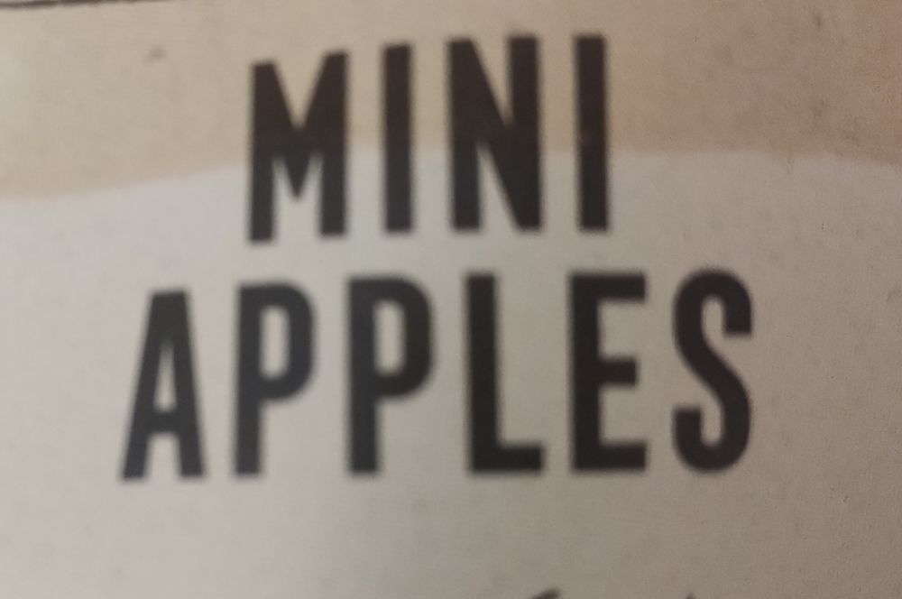 A supermarket label reading "MINI APPLES"