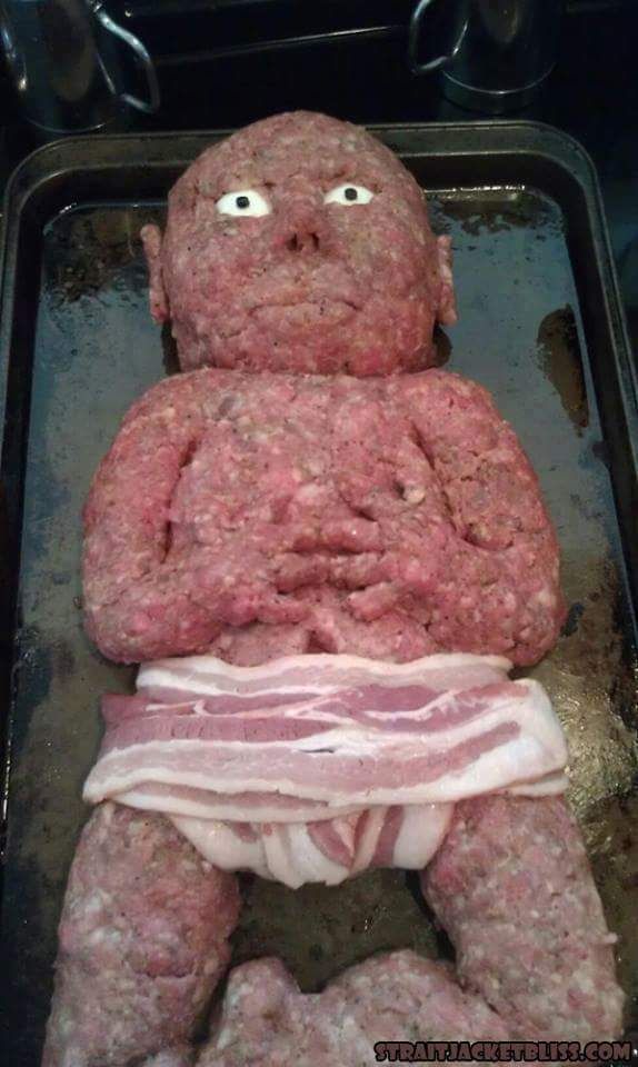 a baby composed of ground beef lying in a pan with a bacon diaper