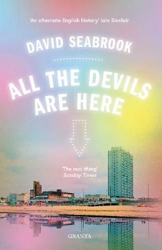 The cover of All the Devils Are Here by David Seabrook. The cover shows a pink and blue sunset over the Kent seaside resort of Margate. The modernist silhouettes of a tower block and the Dreamland funfair are reflected in the waters of the harbour. Above, the title and author text is in white and at the centre of the cover an arrow made of dotted lines points down to the harbour. The overall effect is unsettling and strange