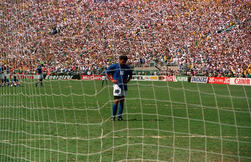 Roberto Baggio staring at the penalty spot after sailing a kick that won Brazil the 1994 World Cup