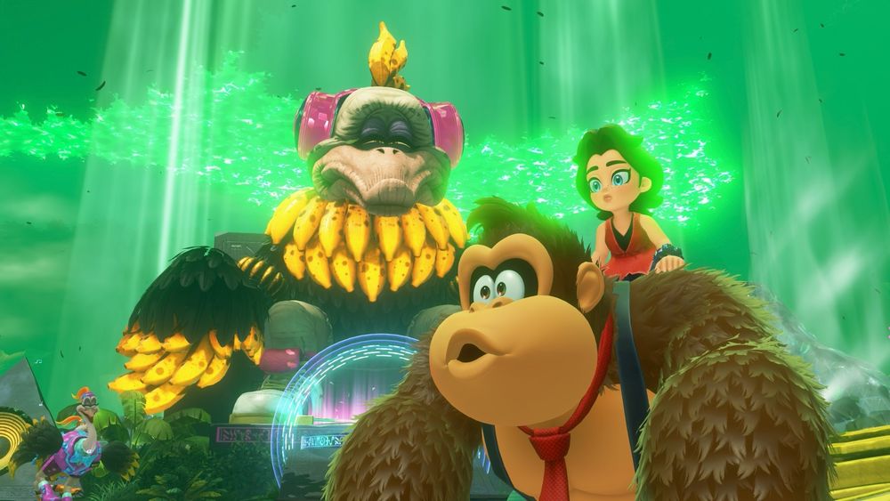Donkey Kong Bananza screenshot. DK and Pauline both look intrigued at something off screen while a titanic Ostrich Elder half-dozed in the background, looming over them.
