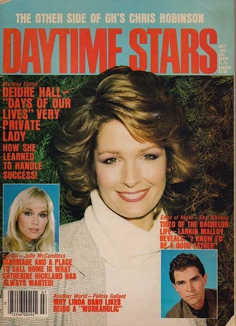 A vibrant magazine cover featuring a large color portrait of Deidre Hall, known for her role as Marlena Evans on Days of Our Lives. She wears a soft blouse and smiles confidently, framed by bold headlines. The cover text describes her as a “very private lady” who’s learned to handle success. Smaller inset photos feature other soap stars including Susan Lucci, Alec Baldwin, and Linda Dano. The layout is bold and colorful, evoking 1980s glamour and star power.
