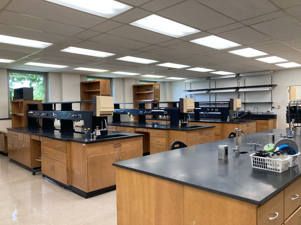 A ln empty lab space with a few benches 
