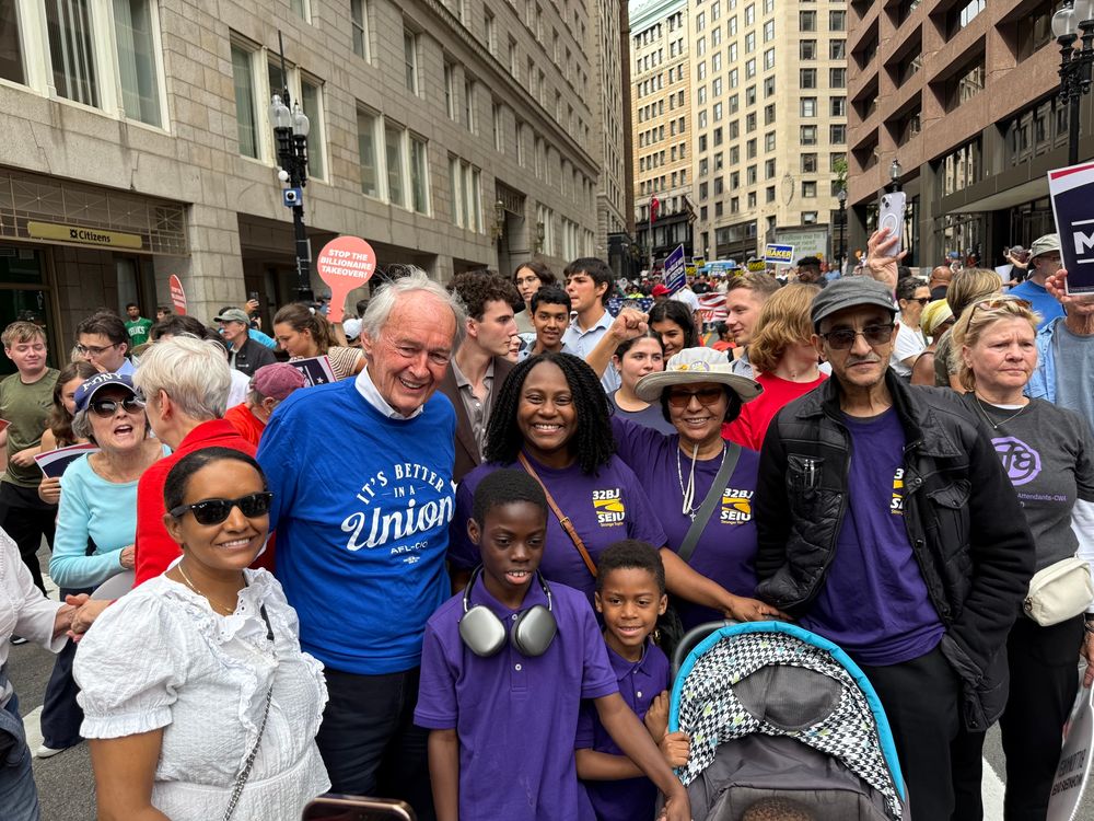 Ed smiles with members of 32BJ SEIU.