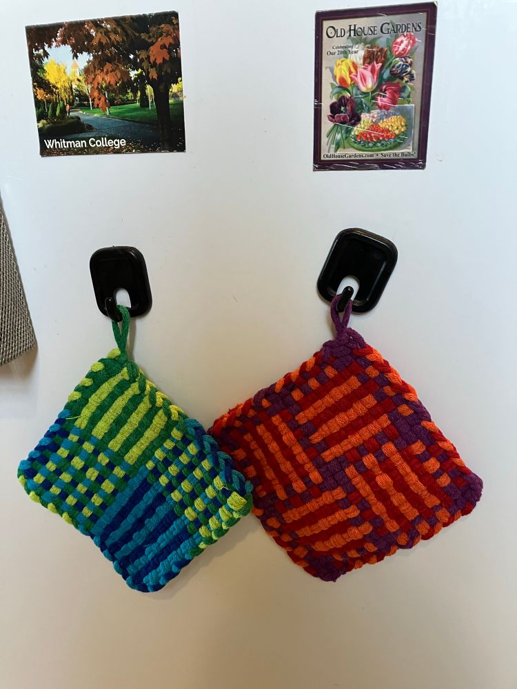 Two handwoven potholders