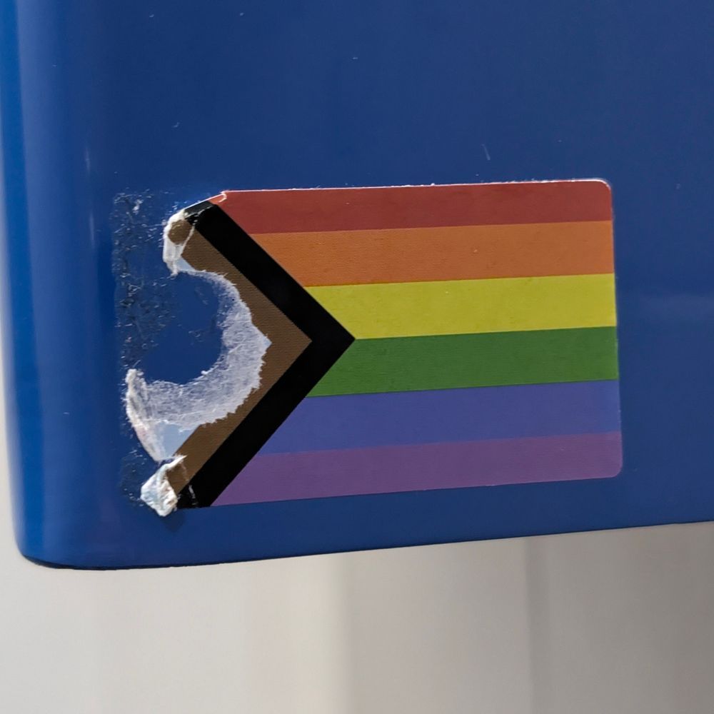 A progress freedom sticker, with the trans colours scratched out. 