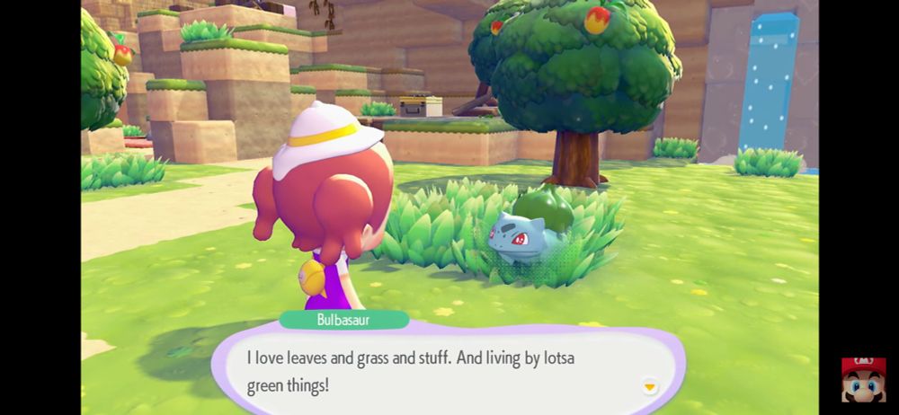 A screenshot from the Pokemonn: Pokopia trailer. Bulbasaur says “I love leaves and grass and stuff. And living by lotsa green things!”