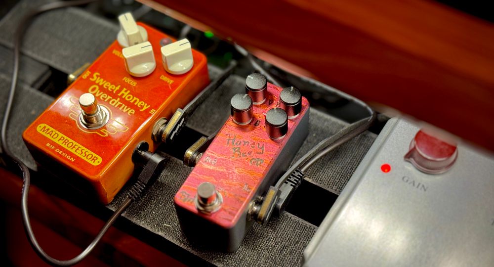Photo of my guitar pedalboard. There are three pedals shown: the Mad Professor Sweet Honey Overdrive, the One Control Honey Bee 4K Mini Custom, and the Ceriatone Centura. 