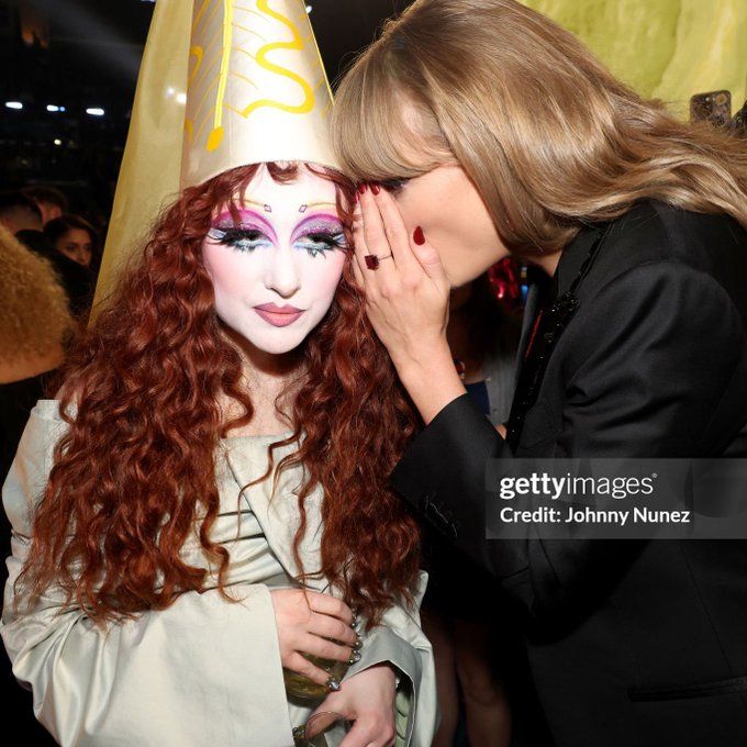 taylor swift and chappel roan at the grammy awards, looking like the famous poster of wicked