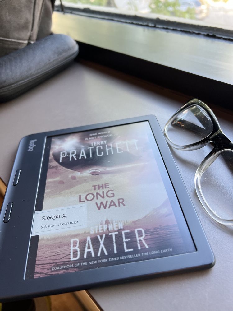 A Kobo ereader displaying the cover art for “The Long War”. 