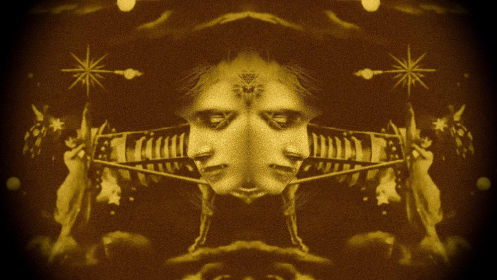 A beautiful two-faced woman super-imposed on reflected articulated horses. The horses are from a George Melies film. It's all sepia-toned,giving it an Edwardian ambience.