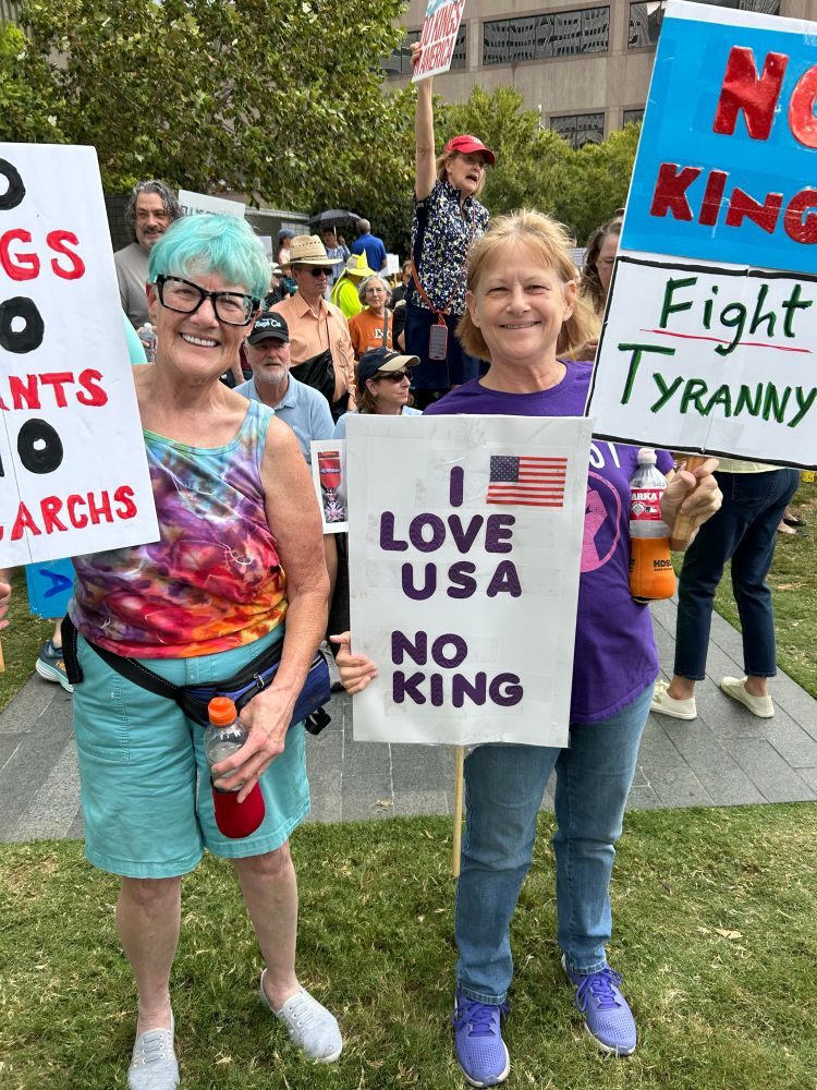 No Kings protesters with signs