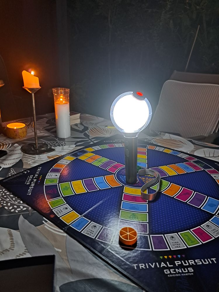 playing trivial with an army bomb standing in the middle of the board with candles in the background, looking like we're doing some kind of ritual instead of playing 