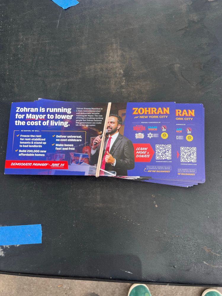 A stack of flyers for Mamdani for Mayor